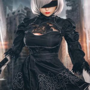 2B gaming sex doll standing in the black character dress, white bob and visor, city set