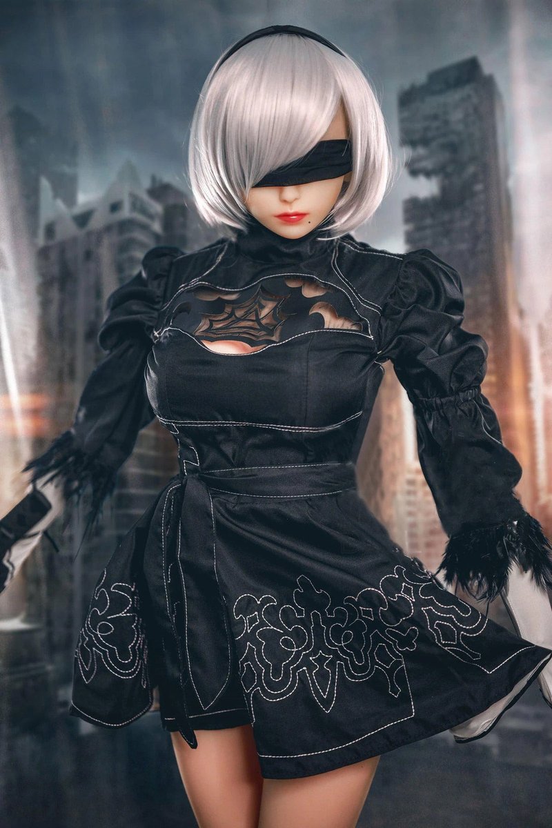 2B gaming sex doll standing in the black character dress, white bob and visor, city set