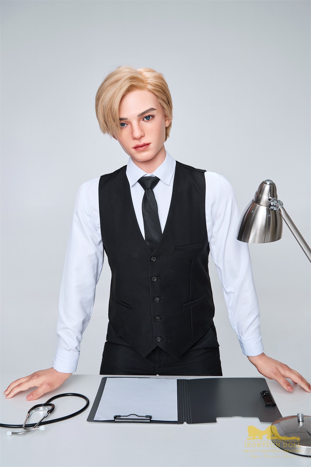 Benjamin 170cm male doll standing behind a desk in vest and tie