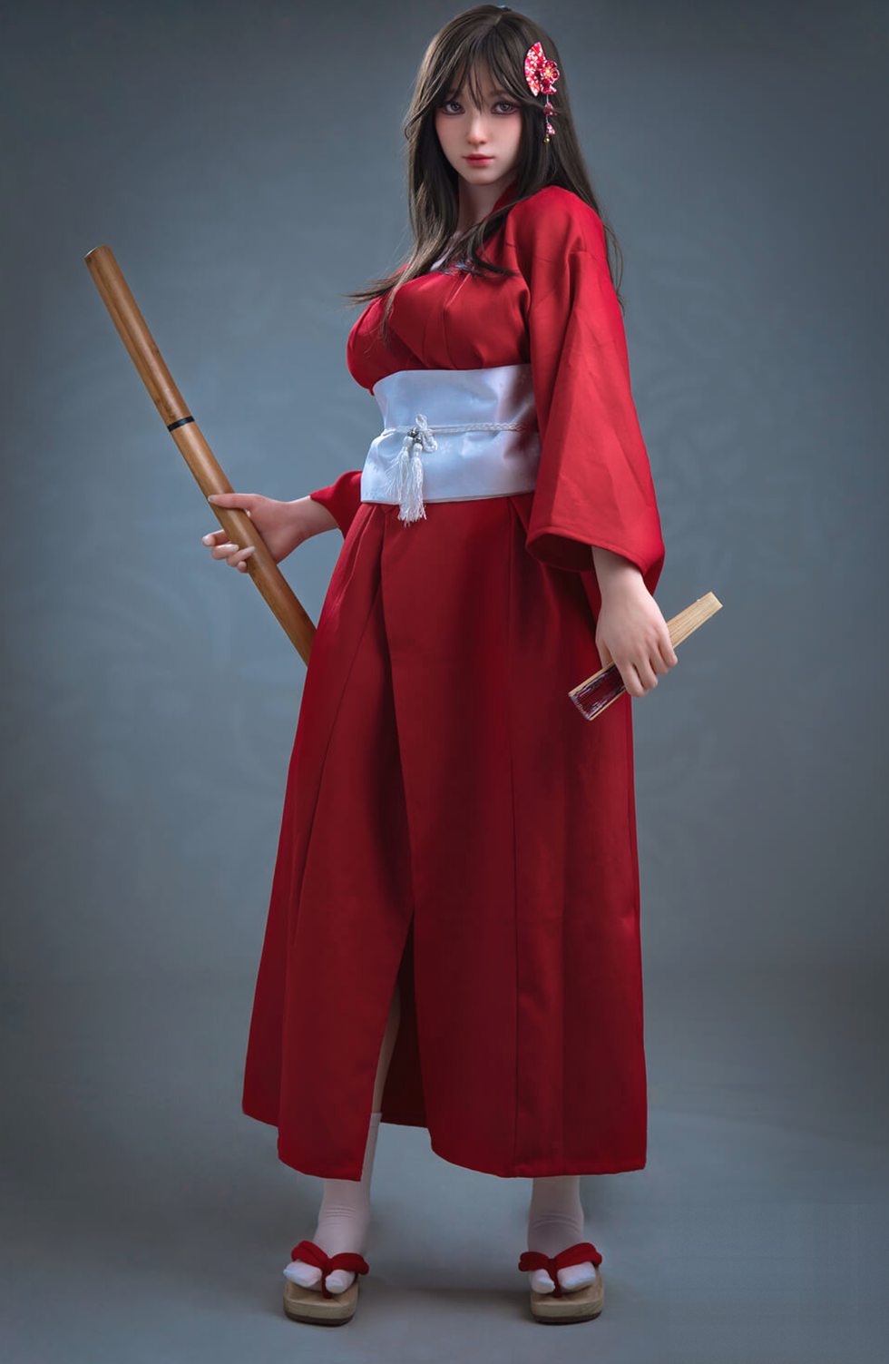 Hinata 164 cm sex doll standing full length holding a wooden bokken