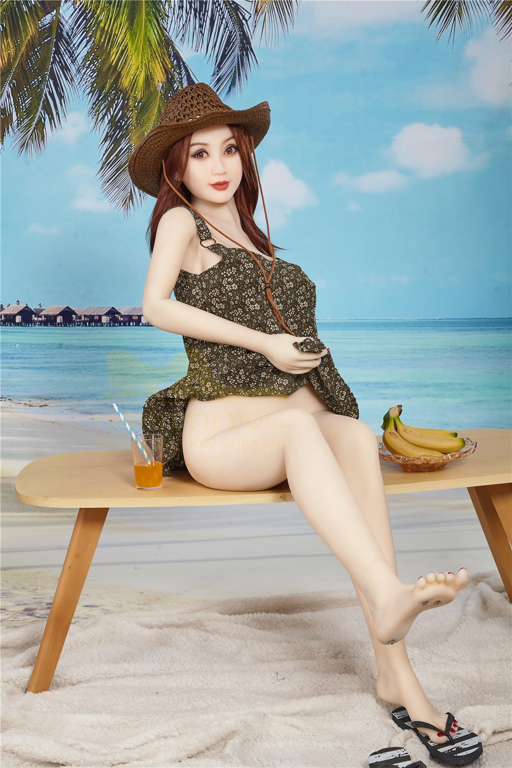 Isla, a 157 cm slim TPE sex doll seated on a beach bench