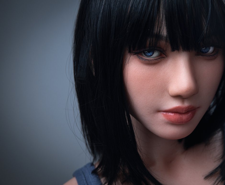 Face of Magnolia, a 153 cm silicone doll with blue eyes and blunt bangs