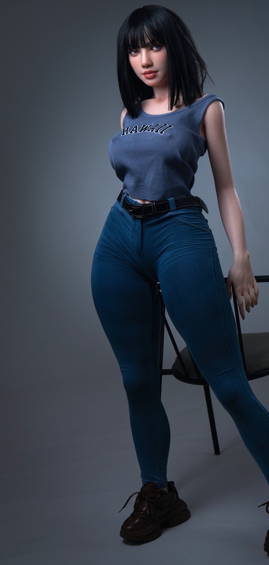 Magnolia, a 153 cm silicone sex doll standing in jeans and sneakers