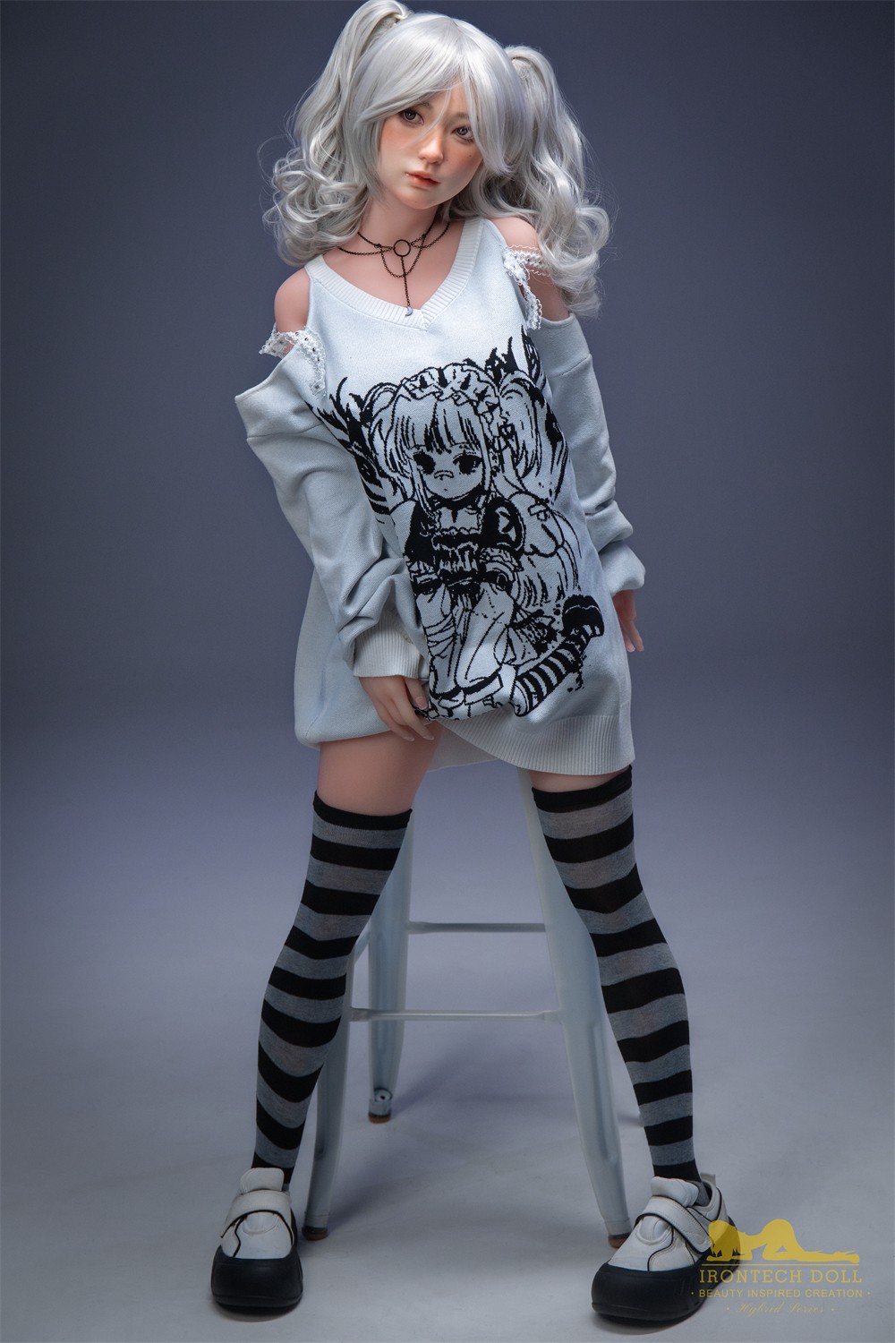 Olivia, a 154 cm hybrid sex doll with a silicone face and TPE body, standing in an oversized sweater and striped socks