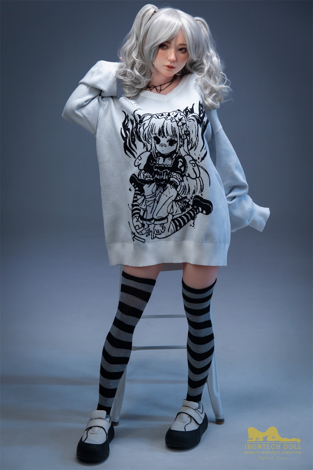 Olivia, a 154 cm hybrid sex doll, full standing figure in sweater and striped socks