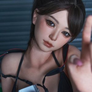 Willow, a 158 cm anime style silicone sex doll with short dark hair and a camera